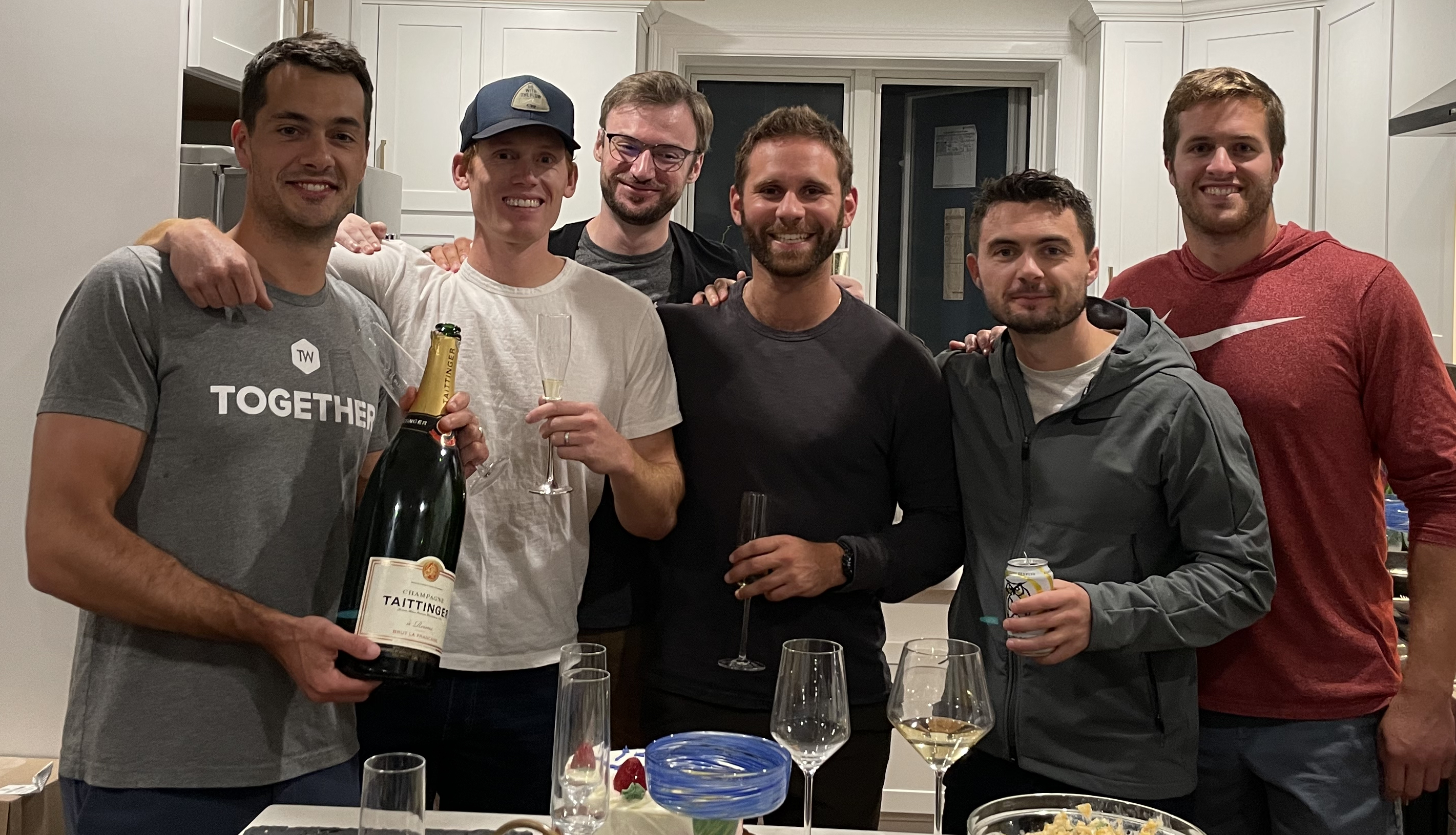 Sean and peers celebrate in a small gathering the evening of the acquisition.