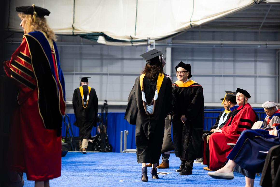 Student crosses the stage at 2024 commencement