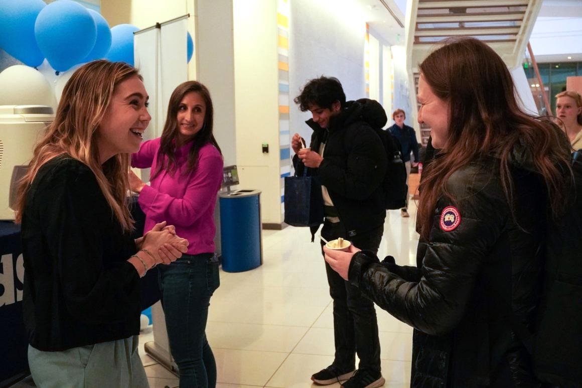 Molly Ryan and student talking