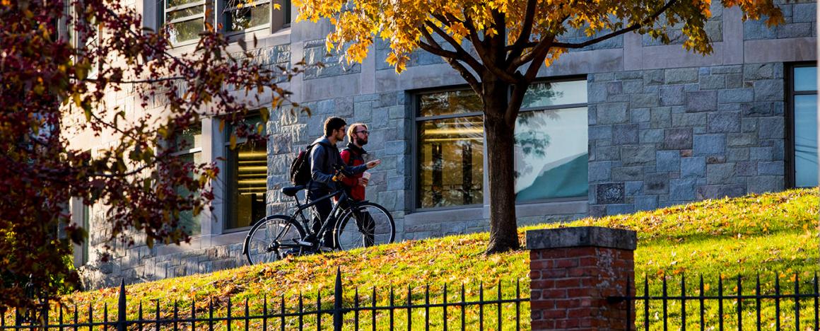 Students walking at Tufts University campus during autumn