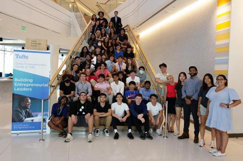 Pre-college students gathered for photo on staircase of Joyce Cummings Center